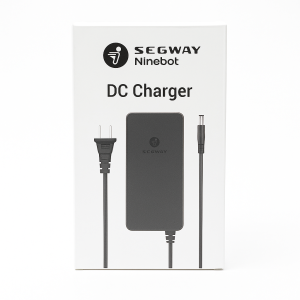 Official Segway Ninebot DC charger retail packaging box with product image and branding
